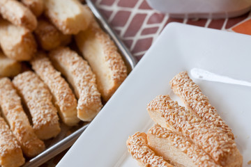 Pastry cakes with sesame on plate.