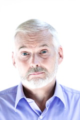 Senior man portrait mistrust sullen