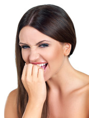 Fototapeta premium Portrait of beautiful woman, she bites her fingers