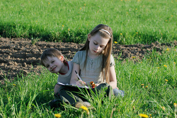 Brother and sister in summer day.