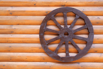 Wall house with an attached wheel
