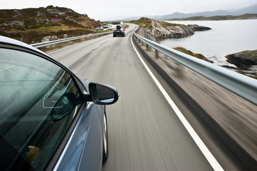 Obraz na płótnie Canvas car driving the Atlantic road, Norway