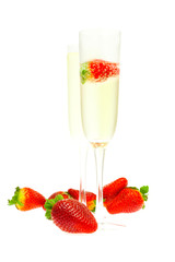 wine glass of champagne and strawberries isolated on white