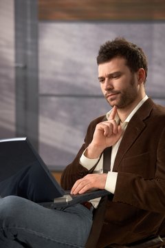 Troubled man with laptop
