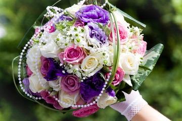 Colorful wedding bouquet in bride's hands
