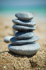 Fototapeta na wymiar Stone stacks on a pebble beach