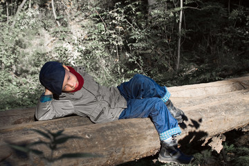 Fototapeta na wymiar boy lying on the bridge
