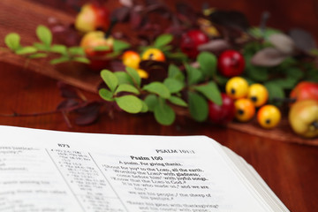 Thanksgiving arrangement with the Bible open at Psalm 100