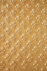 Goldened fleur de lys seamless pattern
