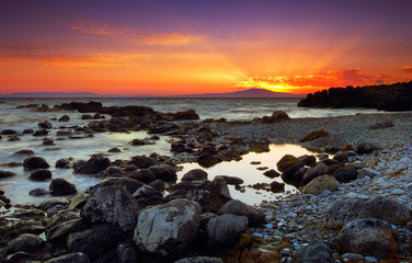 Glorious sunset over rocky sea