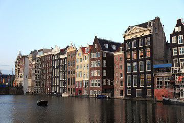 Fototapeta premium Amsterdam canal houses dutch architecture water city travel building europe destination amstrdam nethelands