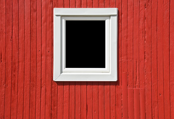 White Window on Red Wall of a Caboose