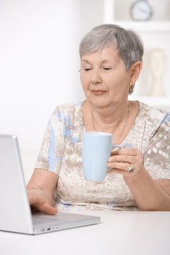 Senior woman browsing internet