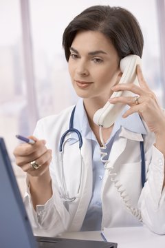 Female doctor working at desk