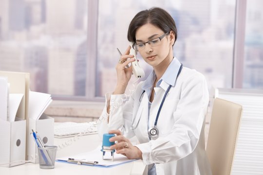 Female doctor talking on phone