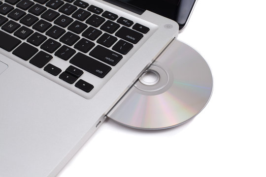 Closeup image from a laptop and a CDRom