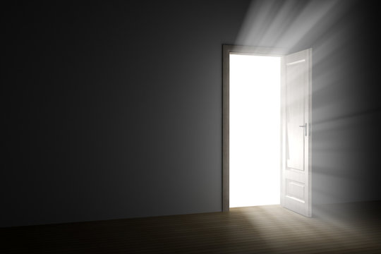 bright light through an open door in empty room.