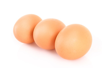 Three brown hen's eggs isolated on white