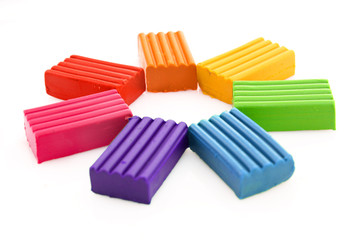 Childen bright multicoloured plasticine  isolated on white