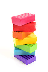 Childen bright multicoloured plasticine in the column  isolated