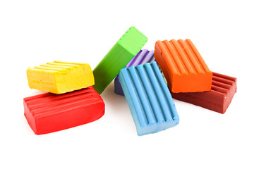Childen bright multicoloured plasticine set chaotically isolated