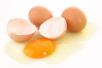 Group of cracked hen's egg isolated on white