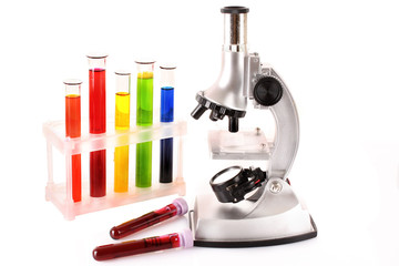 Laboratory metal microscope and test tubes with liquid isolated