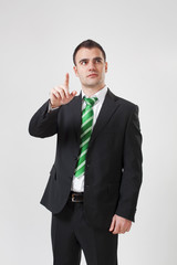 portrait of businessman pointing up