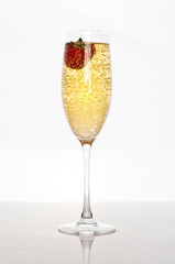 fresh strawberry in glass of champagne