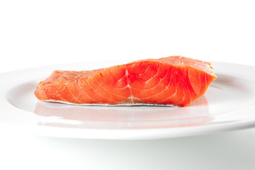 fresh smoked salmon on white plate