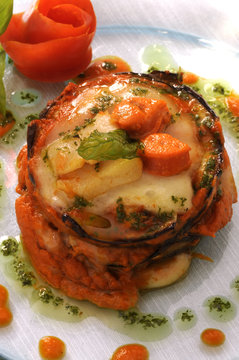 Parmigiana di capesante melanzane e scamorza fum&egrave;