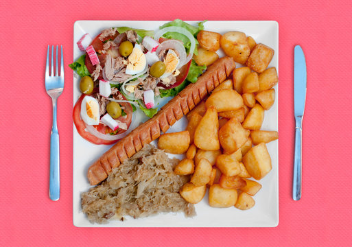 wratwurst with sauerkraut salad and potatoes