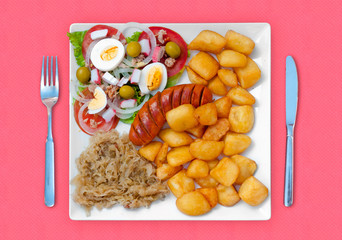 wratwurst with sauerkraut salad and potatoes