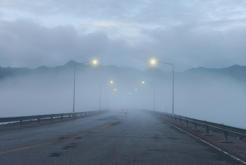 Foggy road on top of the dam - 25768784