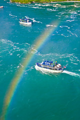 Rainbow over tourist boats, Niagara falls