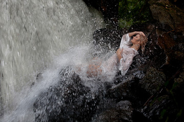 Young Woman Near The Waterfall