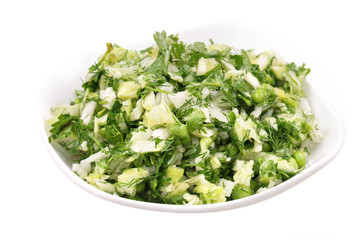 Fresh salad from vegetables and greens on a plate