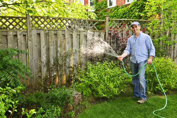 Man watering garden