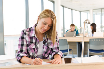 High school - Thoughtful female student in classroom