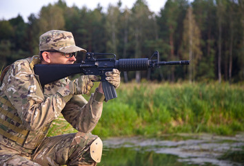 Fototapeta premium Soldier with a rifle