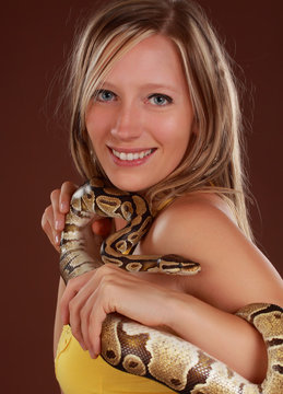 woman holding a snake