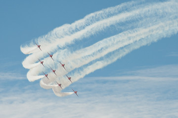 formation aerobatics team leaving smoke trails in the sky - obrazy, fototapety, plakaty