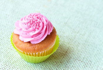 Vanilla cupcake with strawberry icing