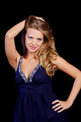 Fototapeta premium a charming young blonde on a black background