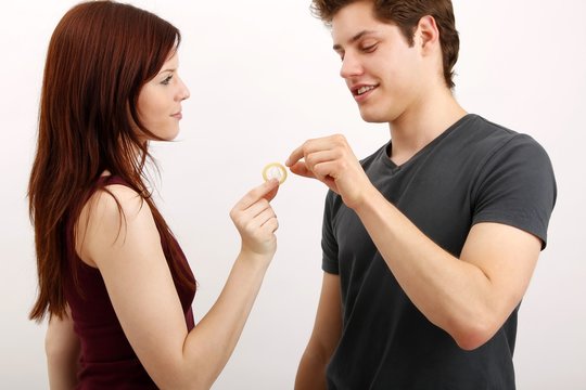 young couple with a condom