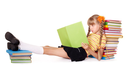 Schoolgirl reading pile of books. Isolated.