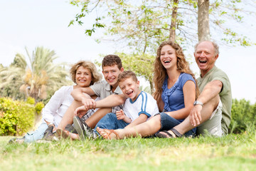 Fototapeta premium Affectionate family having fun outdoors