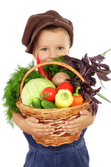 Little boy with basket of vegetables, isolated on white