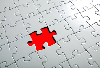 Fototapeta premium Missing puzzle piece, focus around the empty space.