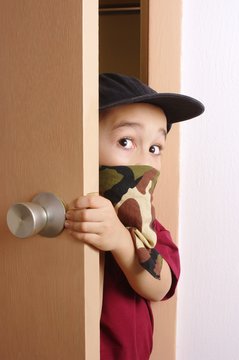 Kid Sneaking Through Door